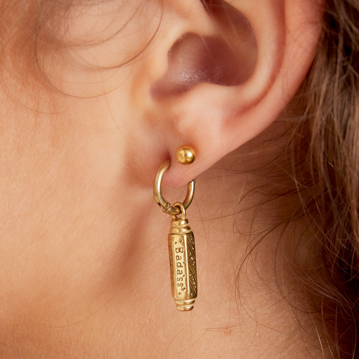 golden earrings bad ass pendant